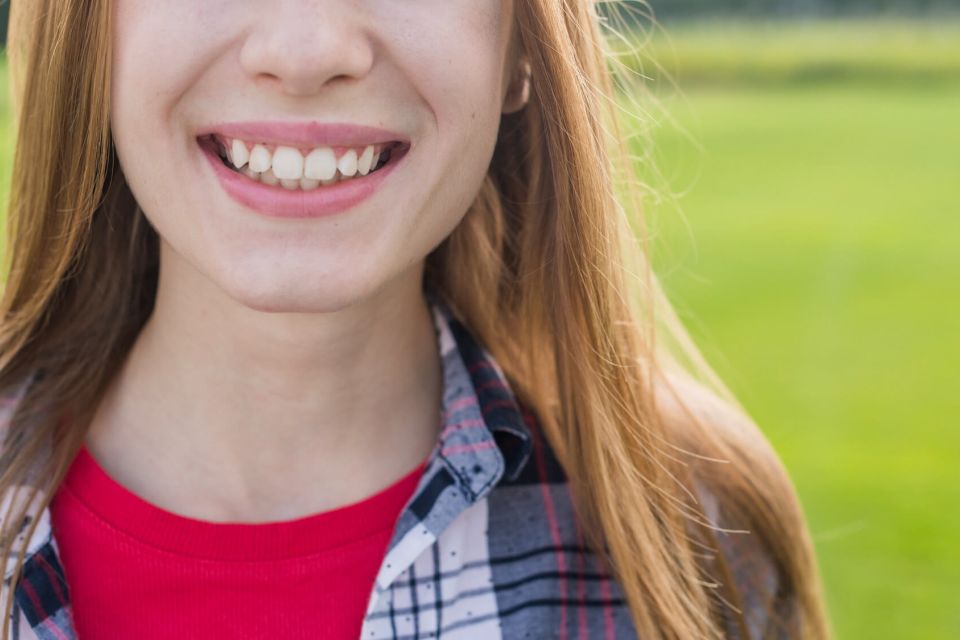 Front view girl smiling with her teeth