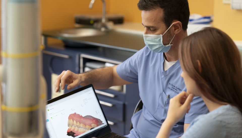 Orthodontist with patient
