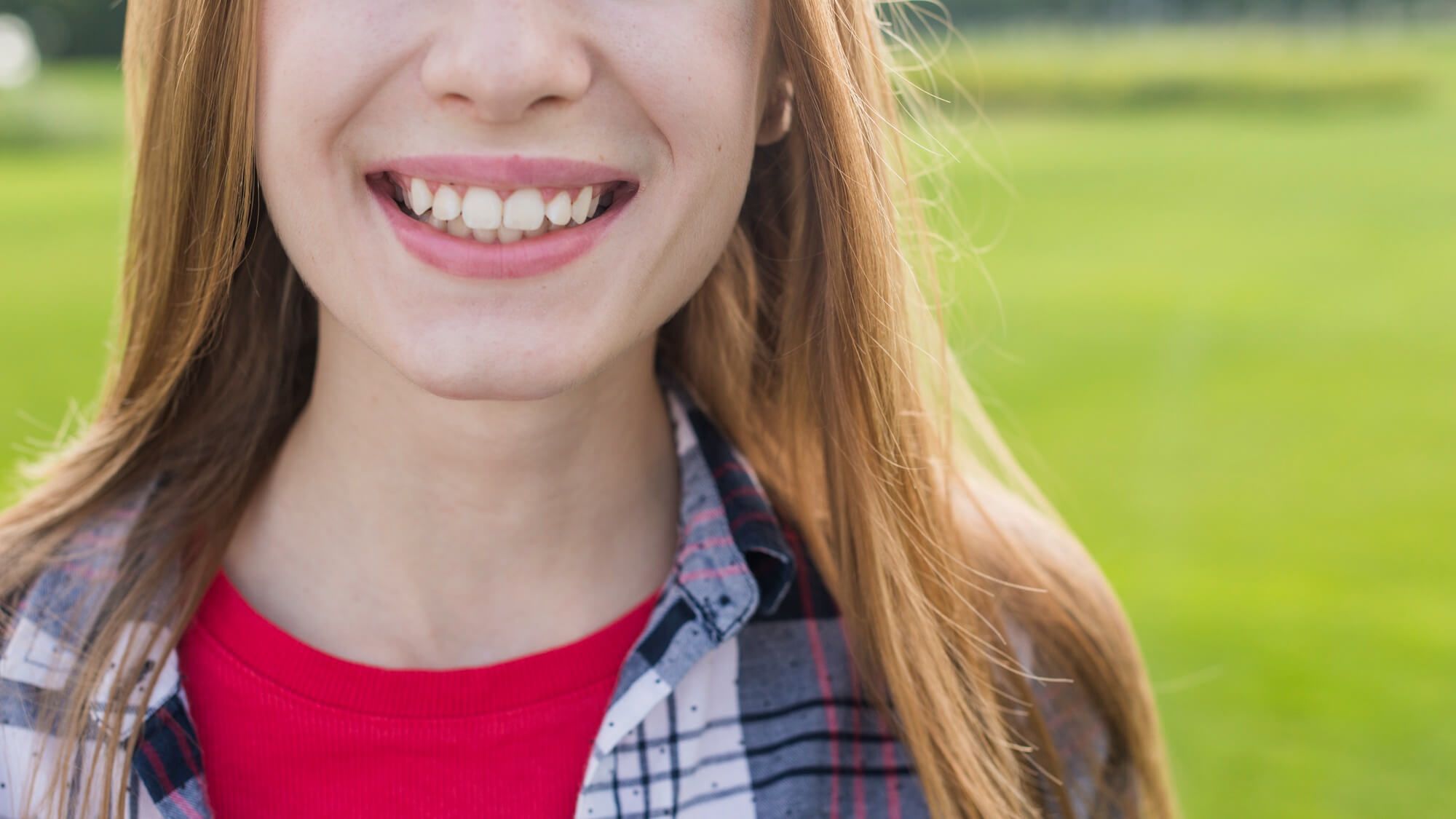 Front view girl smiling with her teeth